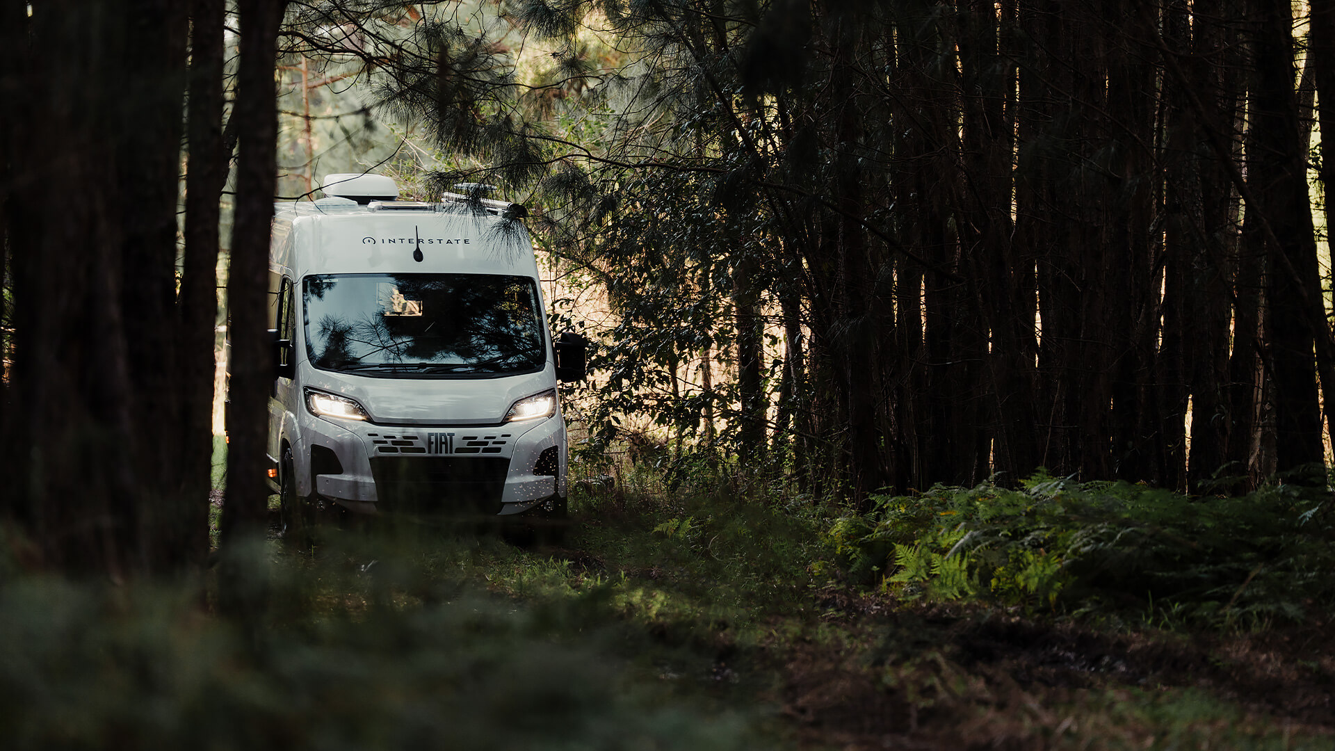 Interstate One motorhome in a forest setting